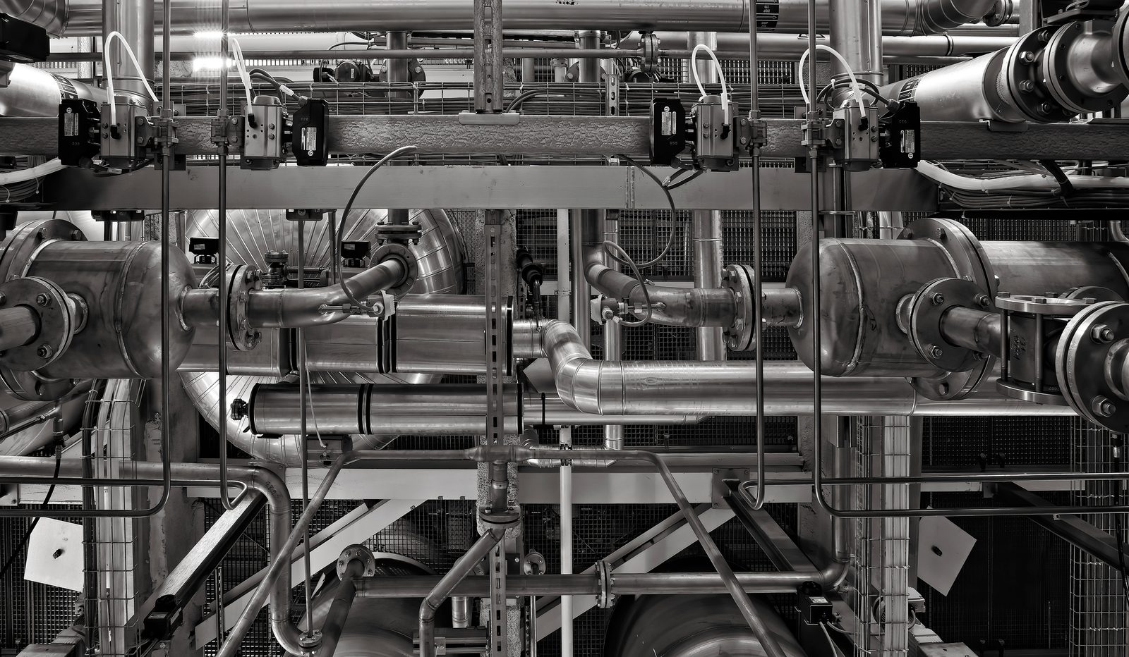 Close-up of industrial pipework and machinery in a manufacturing plant